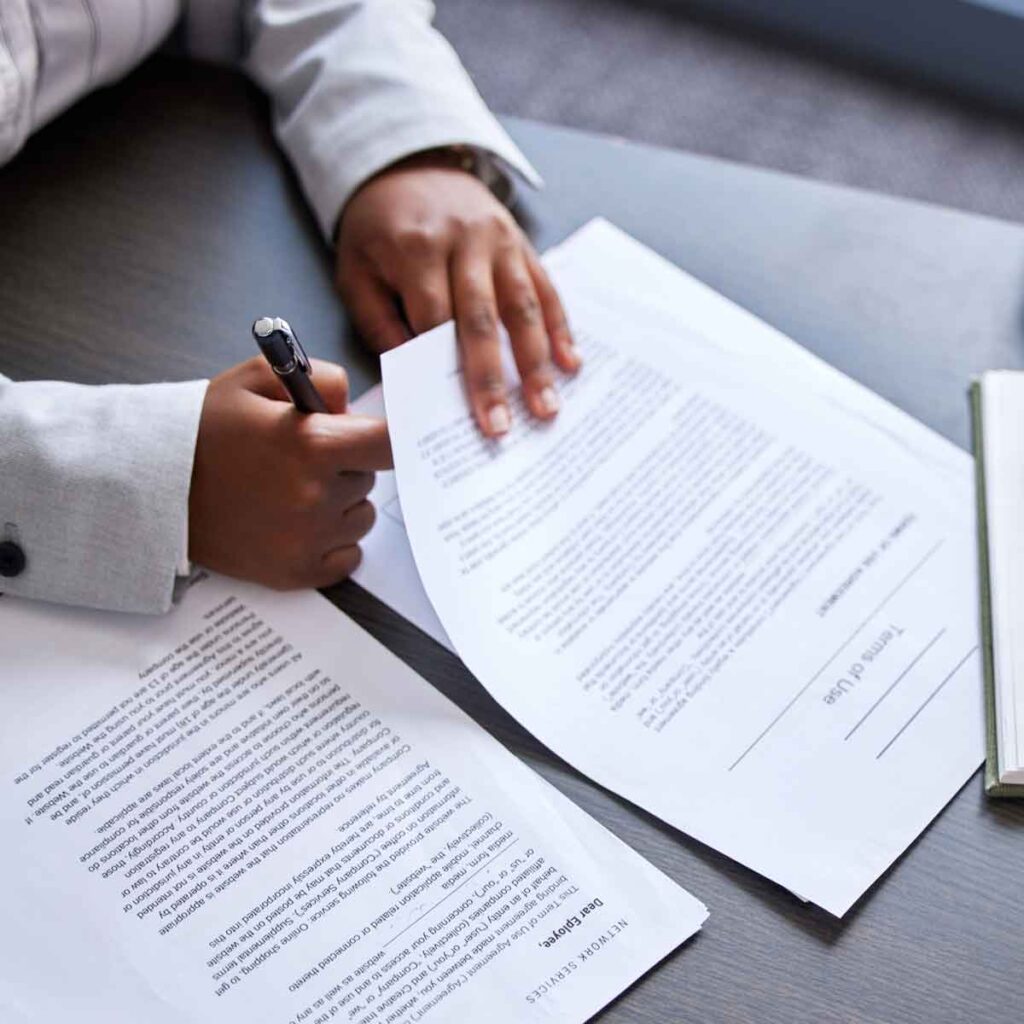 Signing an estate planning contract at Dunham Law LLC.